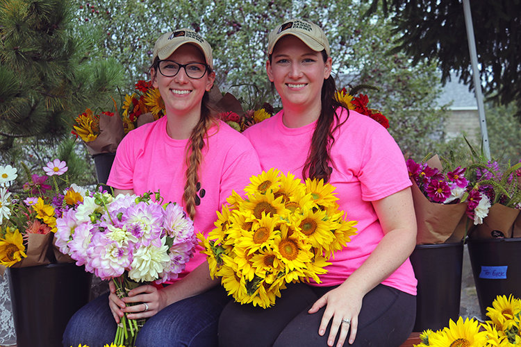 Twin sisters Taylor Ten Eyck, right, and Morgan Willy