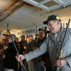 Ron Bernhard passes a gun to another member of Knox’s Helderberg Rod and Gun Club 