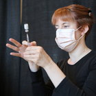 Jessica Bogert readies a Pfizer vaccine