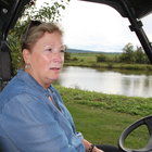 Donna Abbruzzese, seated in a golf cart